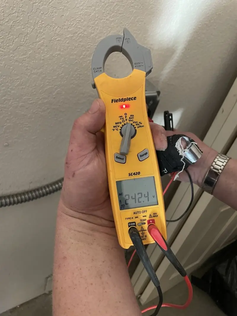 Voltage testing with clamp meter during Ceiling Fan Installation in North Whitehall